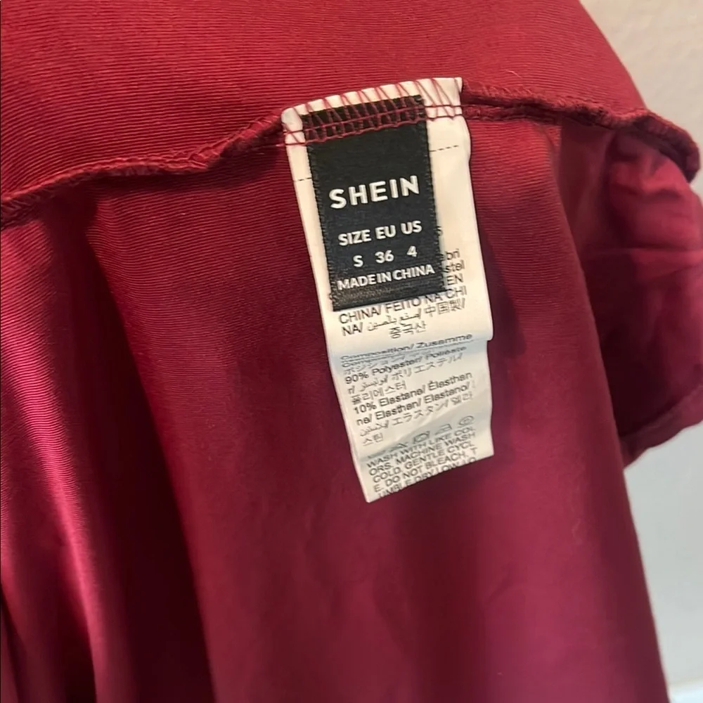 Elegant Asymmetrical Burgundy Dress with Chic Open Areas - Picture 9 of 9